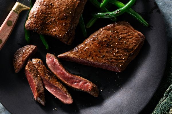 Garlic-marinated top sirloin cap steaks (6 oz / serving)