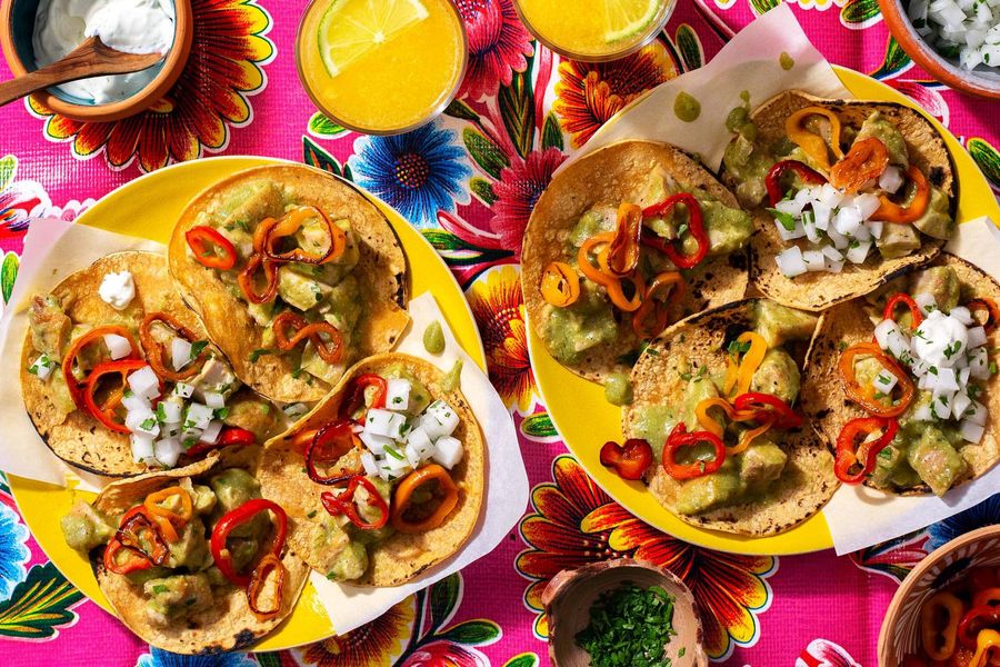 Mexican street tacos with tomatillo chicken, salsa, and lime yogurt