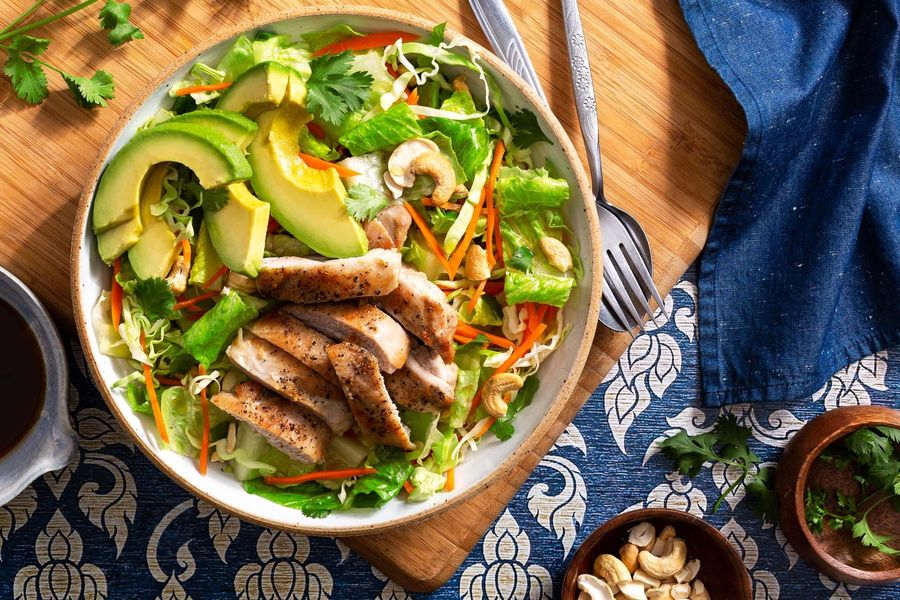 Thai chicken salad with cabbage, carrots, and cashews