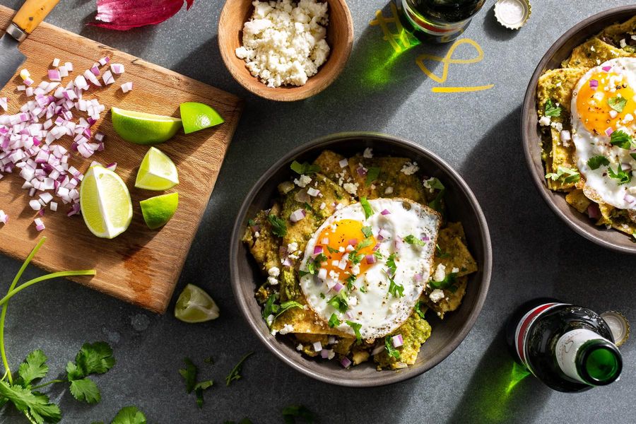 Chilaquiles verdes with fried eggs and queso fresco