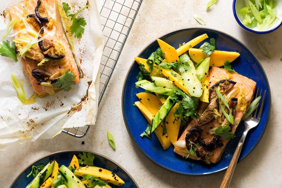 Salmon in parchment with shiitakes and mango-cucumber salad