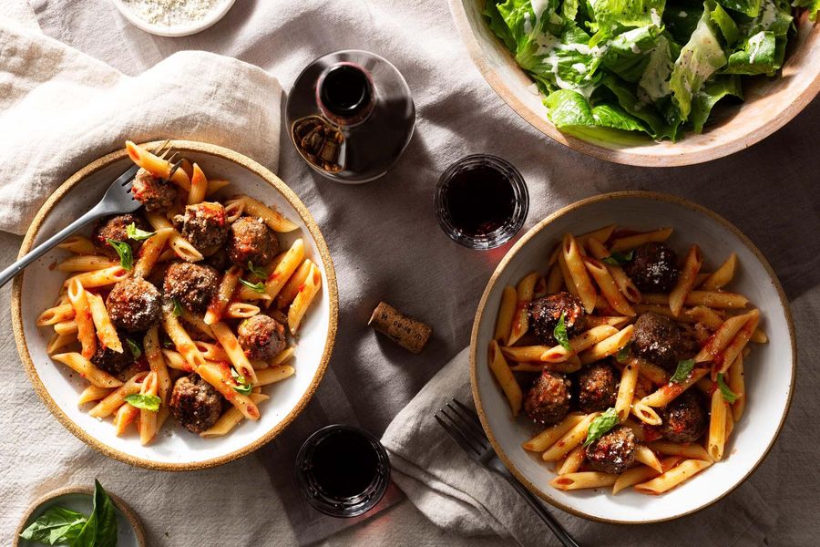 Penne and meatballs in marinara sauce with Caesar salad