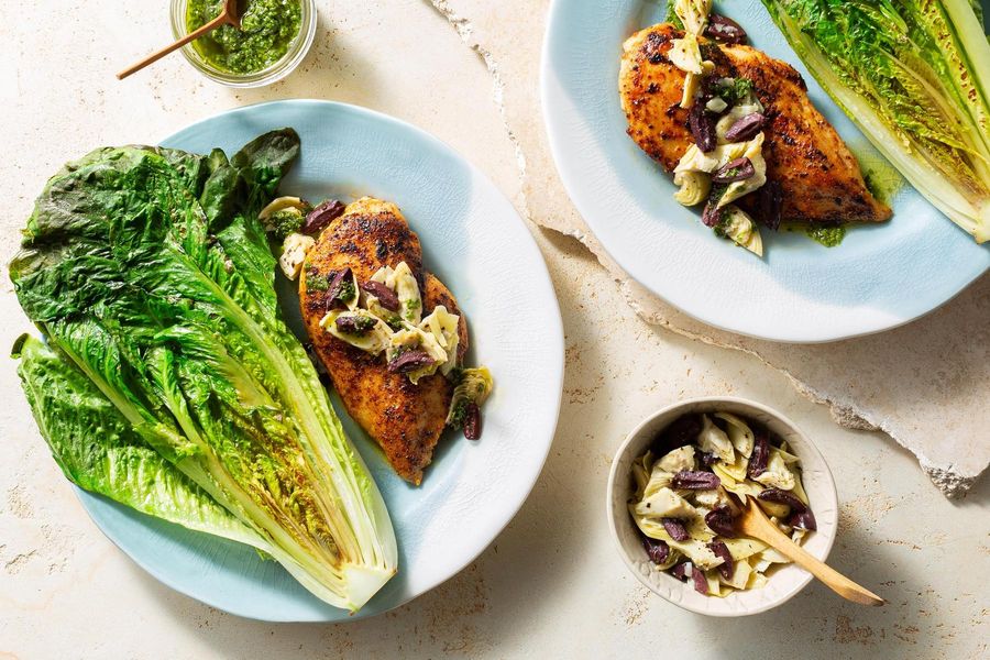 Harissa-rubbed chicken with artichoke tapenade and seared romaine