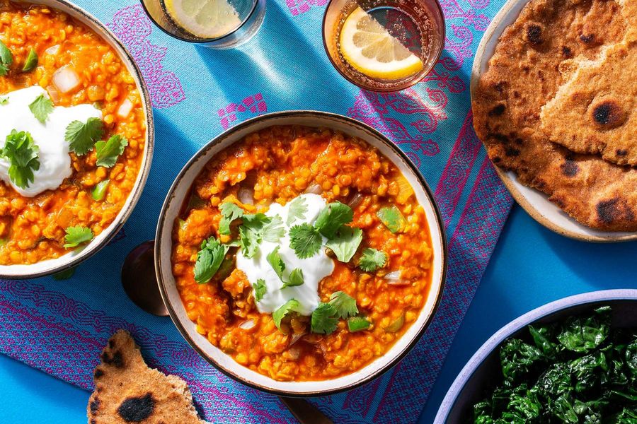 Lentil dal curry with Greek yogurt, wilted kale, and homemade flatbreads