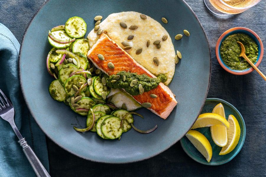 Salmon with ricotta polenta, spicy green harissa, and lemony zucchini