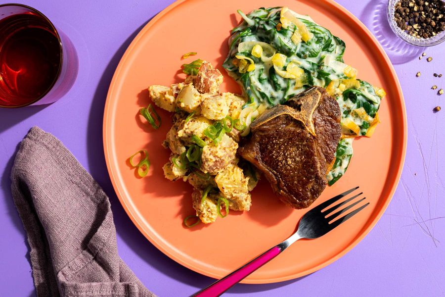 Lamb chops with warm potato salad and creamed spinach