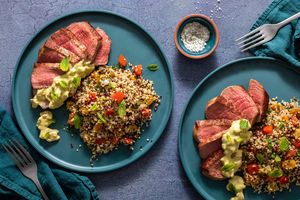 Seared steaks with quinoa-raisin pilaf and pipián verde