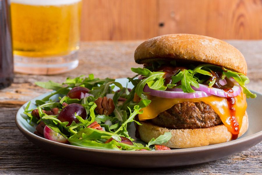 Memphis BBQ cheeseburgers with grape, pecan, and Arugula salad