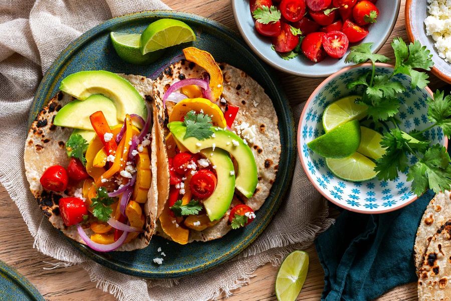 Simple squash fajitas with sweet peppers and queso fresco image