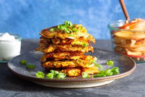 Root vegetable latkes with apple-walnut salad and horseradish yogurt