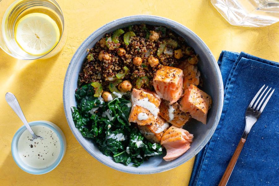 Salmon and quinoa bowls with wilted greens and citrus dressing